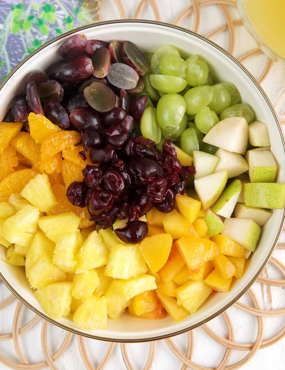 Ingredients for homemade fruit cocktail recipe in mixing bowl