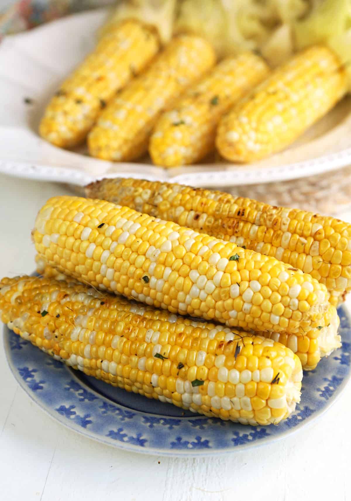 Grilled corn with husks removed