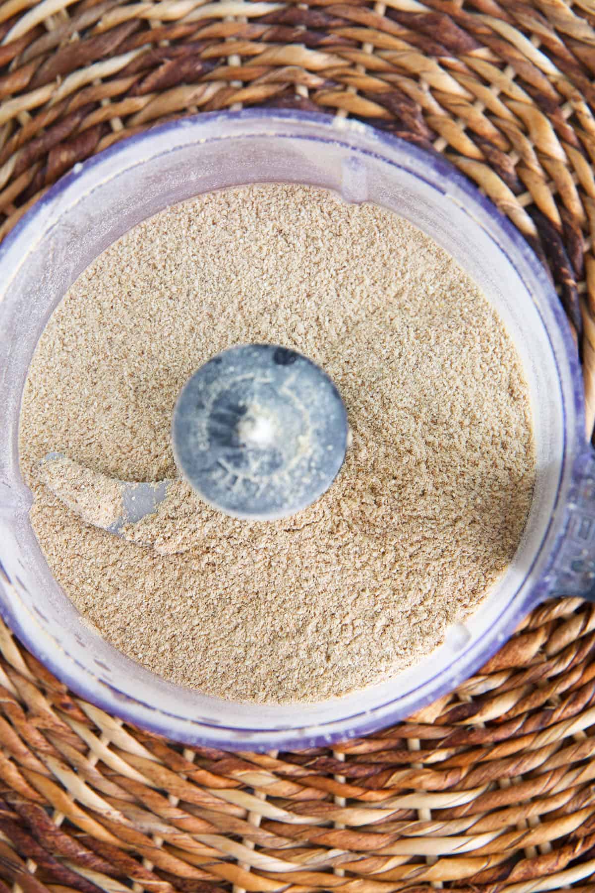 Overhead view of mushroom powder in food processor