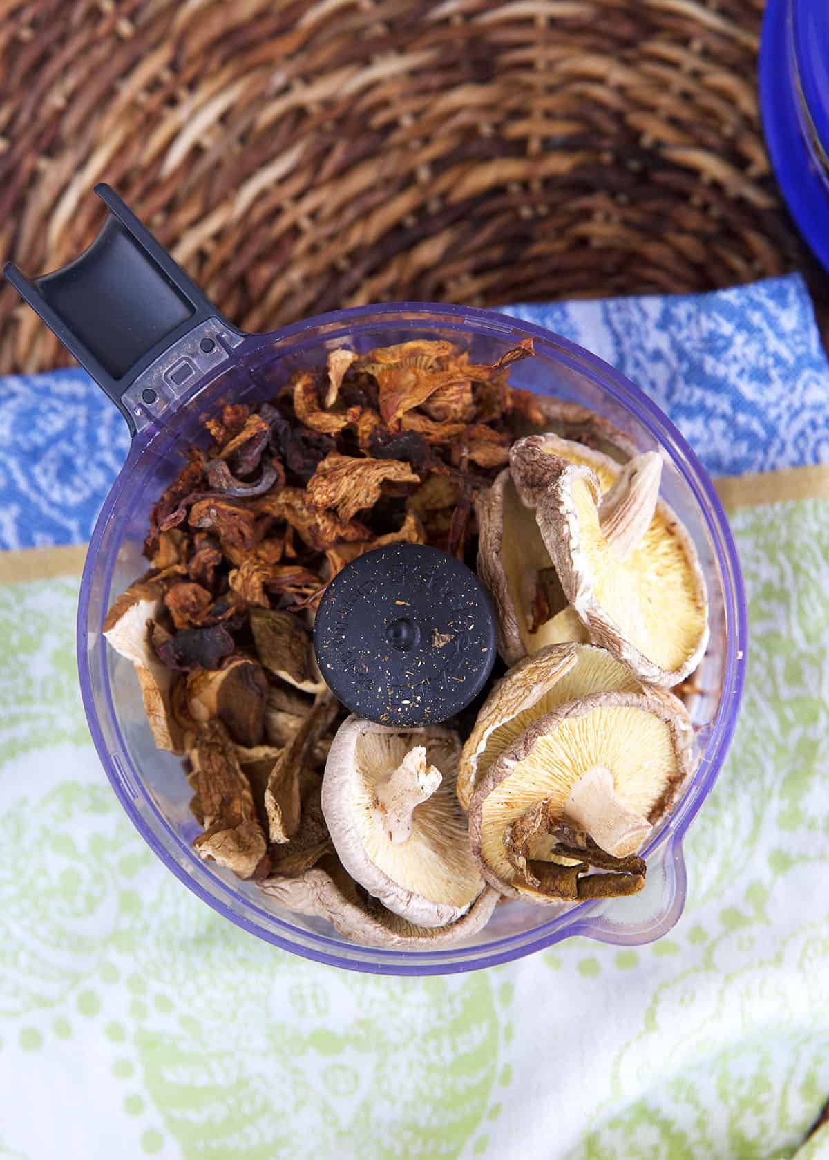 Overhead view of mushrooms in food processor