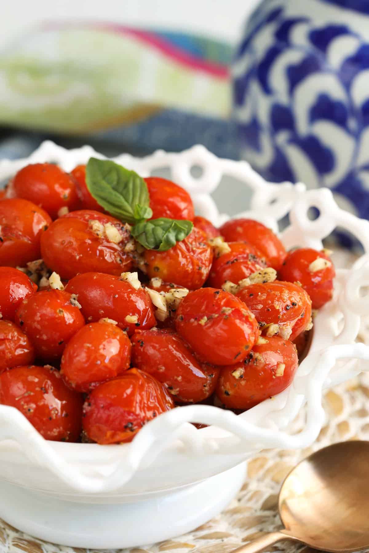 Closeup of roasted cherry tomatoes in serving bowl