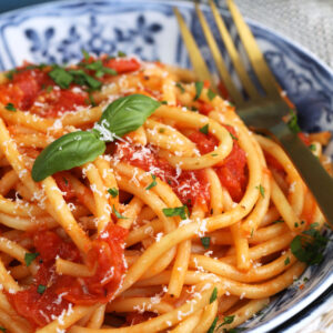 Bowl of pasta topped with roasted tomato sauce