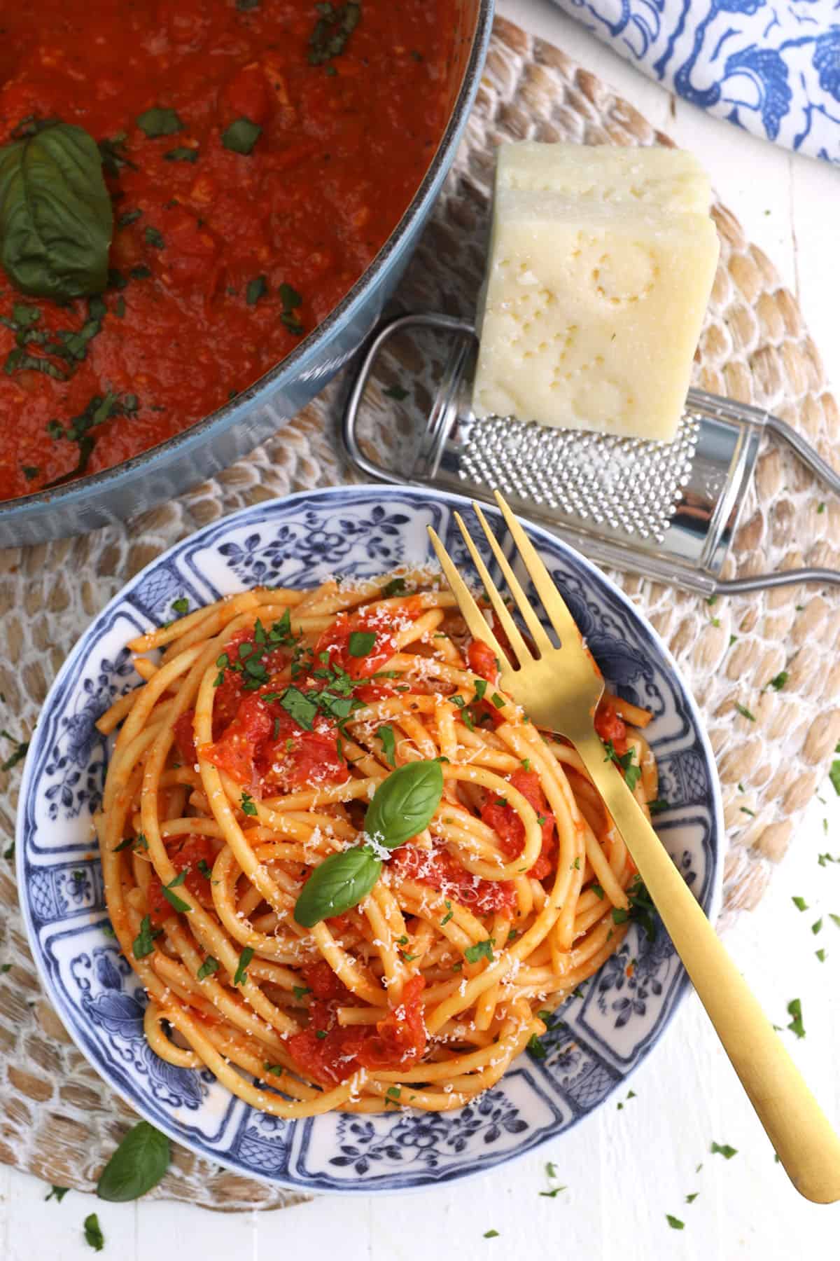 Overhead view of roasted tomato sauce on plate of pasta