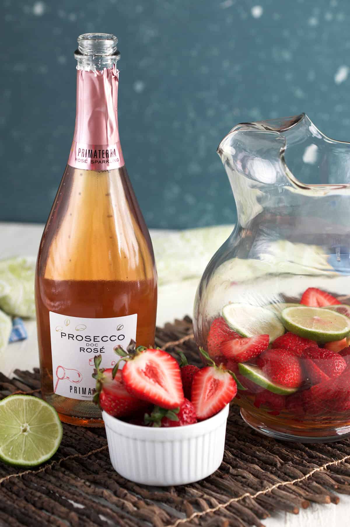 Ingredients for rosé sangria, including rosé and fresh fruit