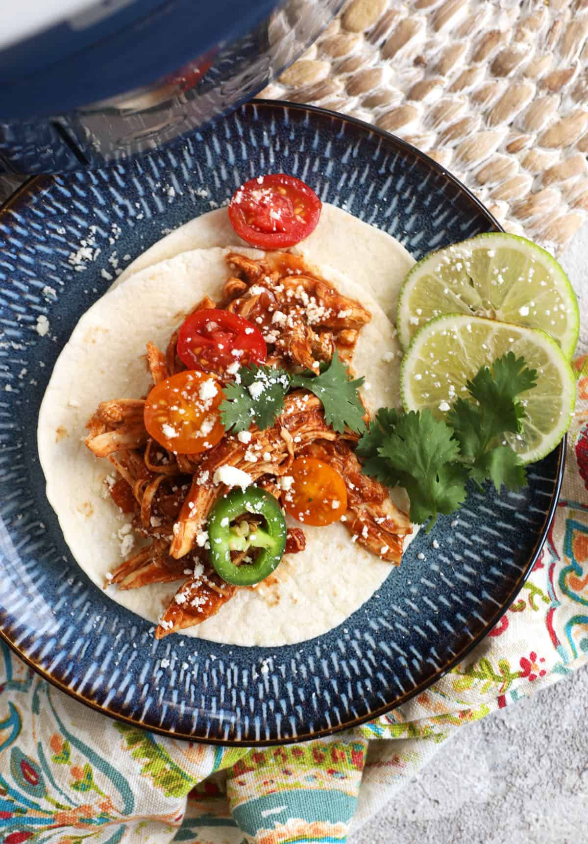 Overhead view of salsa chicken taco filling on tortilla