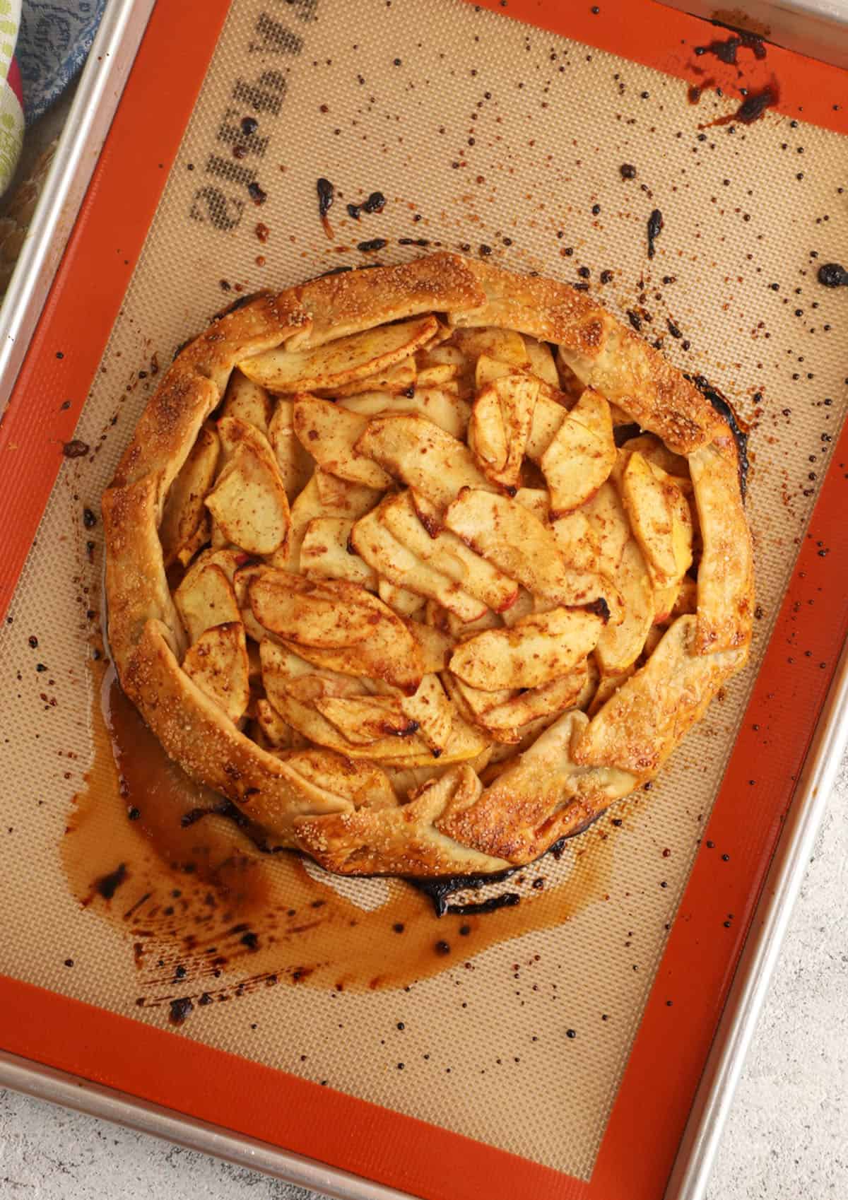 Overhead view of baked apple galette on pan