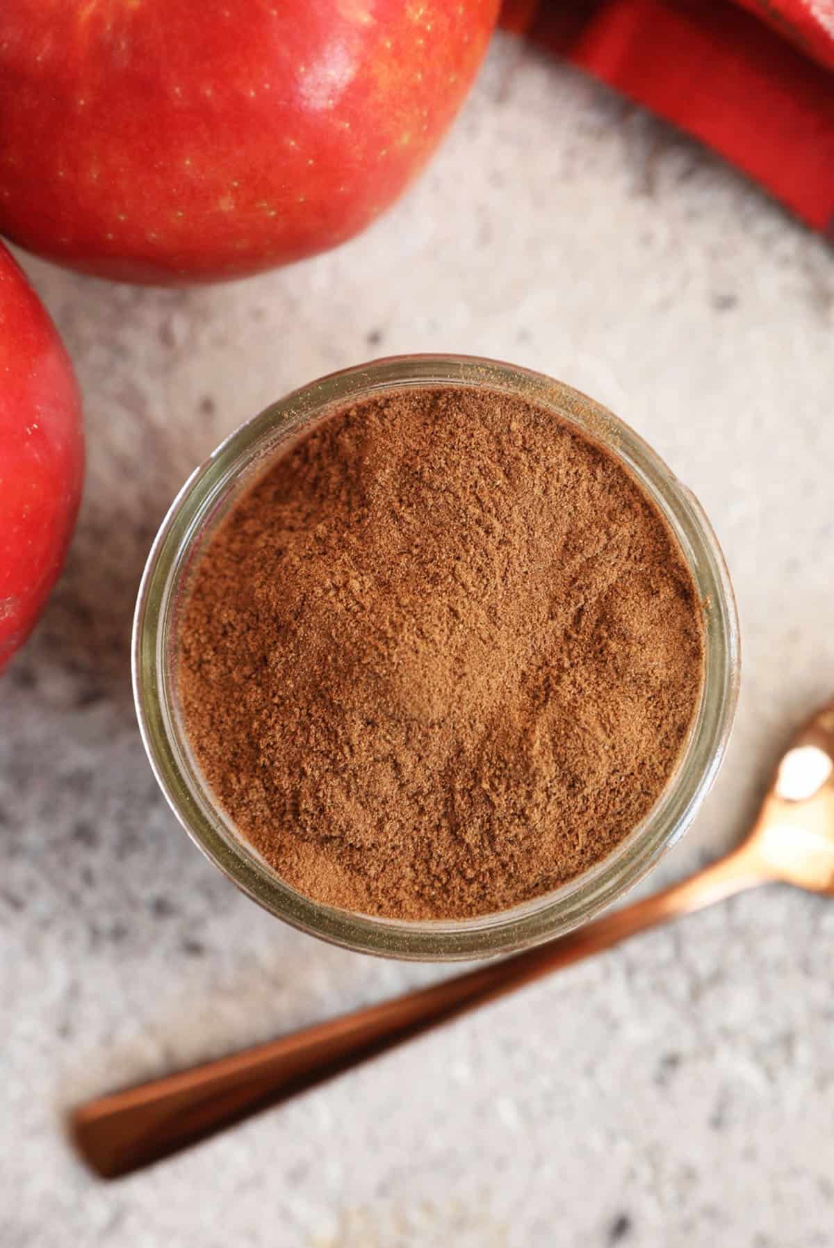 Overhead view of apple pie spice in jar