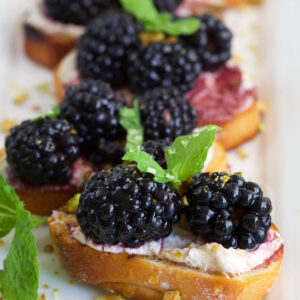 Platter of blackberry goat cheese crostini