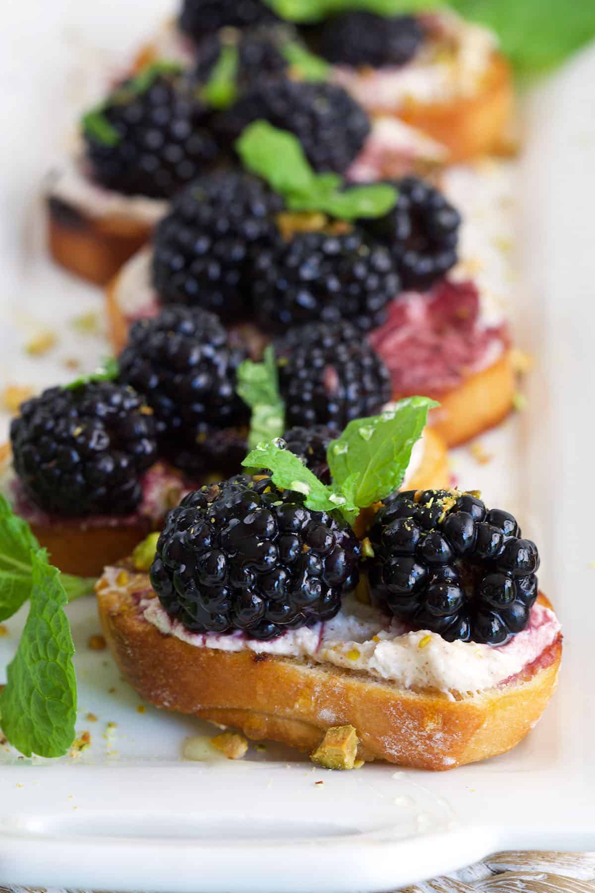 Platter of blackberry goat cheese crostini