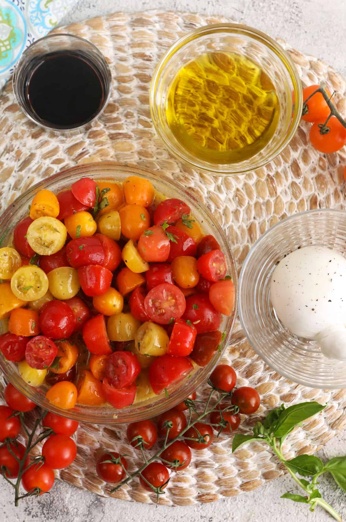 Overhead view of ingredients for burrata caprese