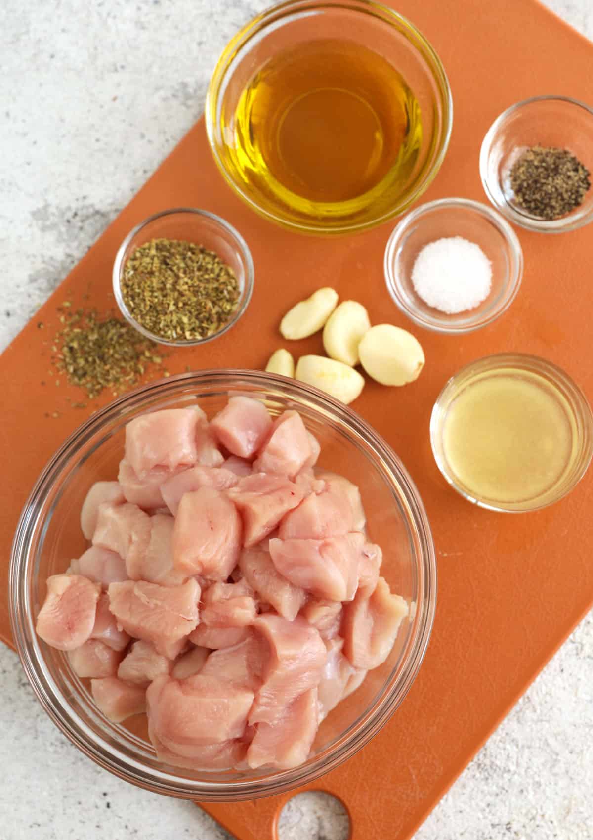 Overhead view of ingredients for chicken souvlaki