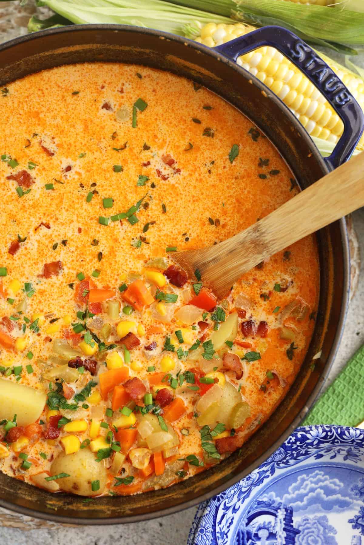 Overhead view of corn chowder in Dutch oven