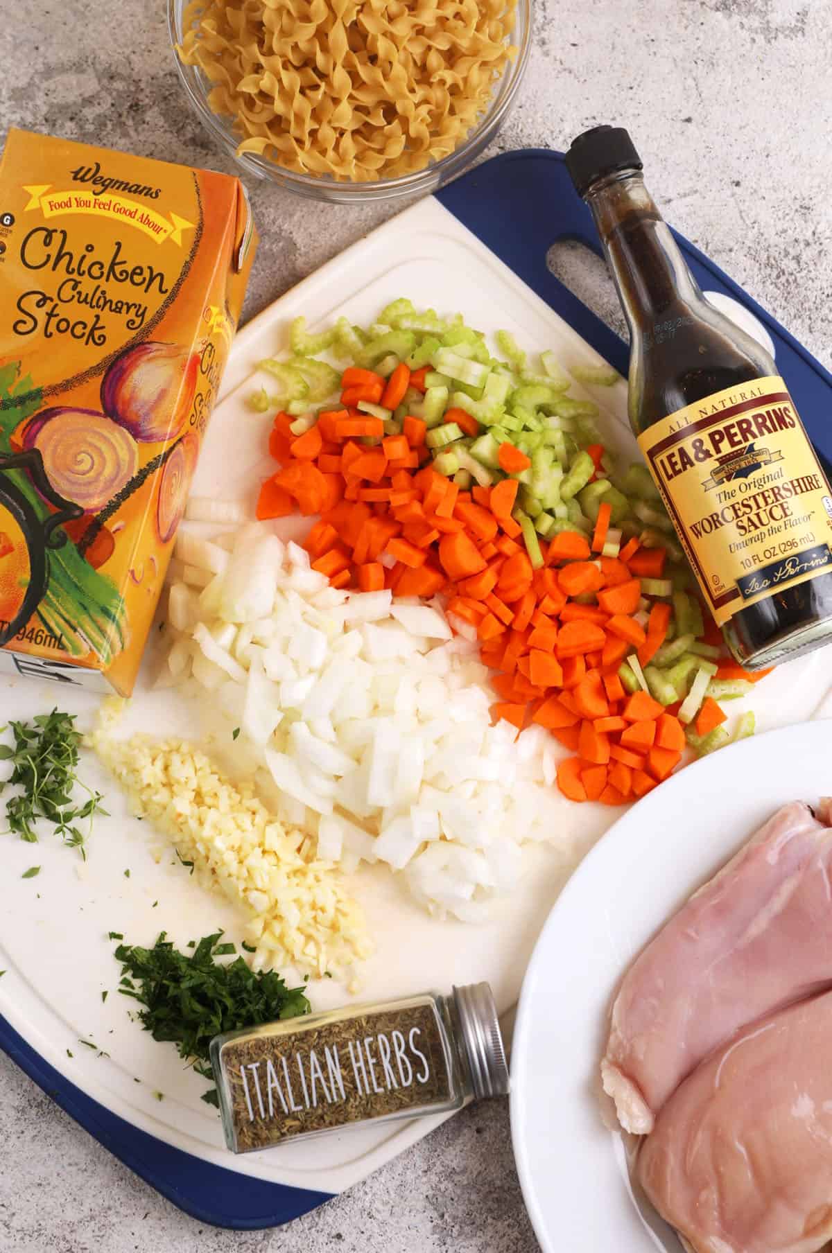 Overhead view of prepared ingredients for crockpot chicken noodle soup