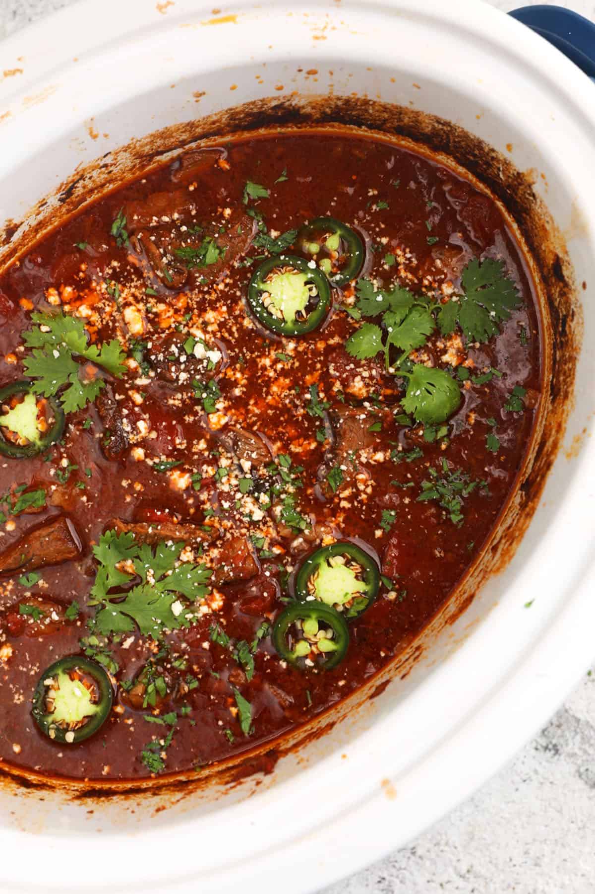 Overhead view of Mexican shredded beef in crockpot