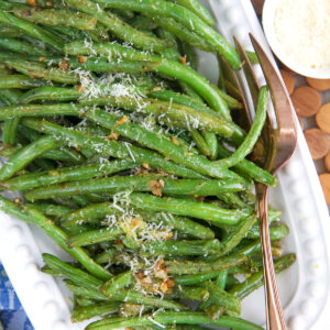 Overhead view of roasted green beans on platter