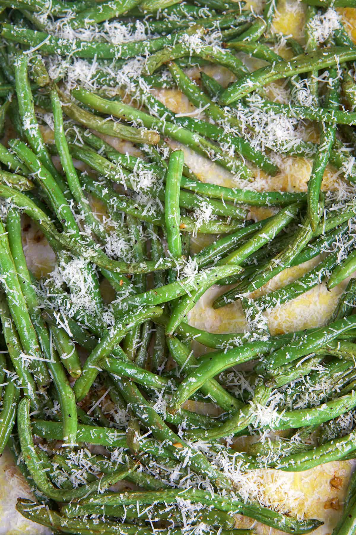 Overhead view of roasted green beans with Parmesan