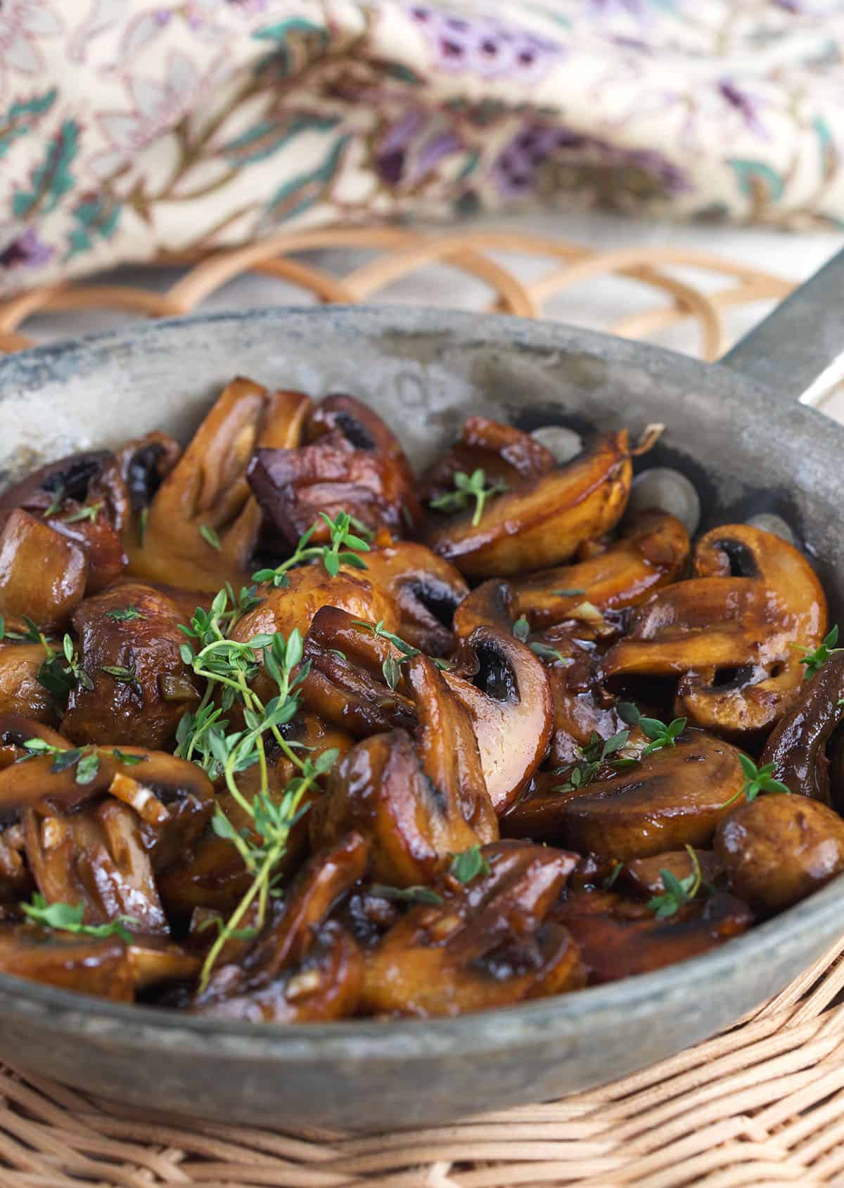 Skillet of sauteed mushrooms with fresh herbs