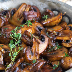 Skillet of sauteed mushrooms with garlic butter