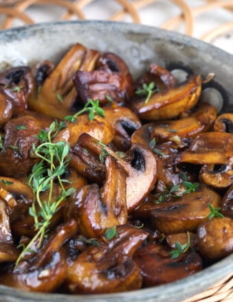 Skillet of sauteed mushrooms with garlic butter