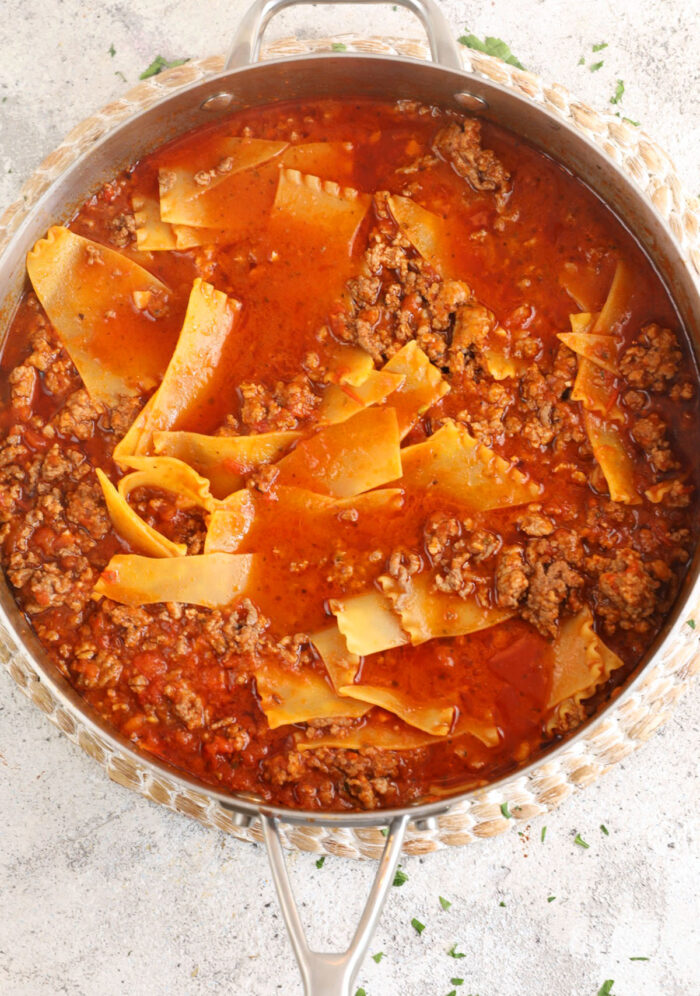 Lasagna cooking in skillet