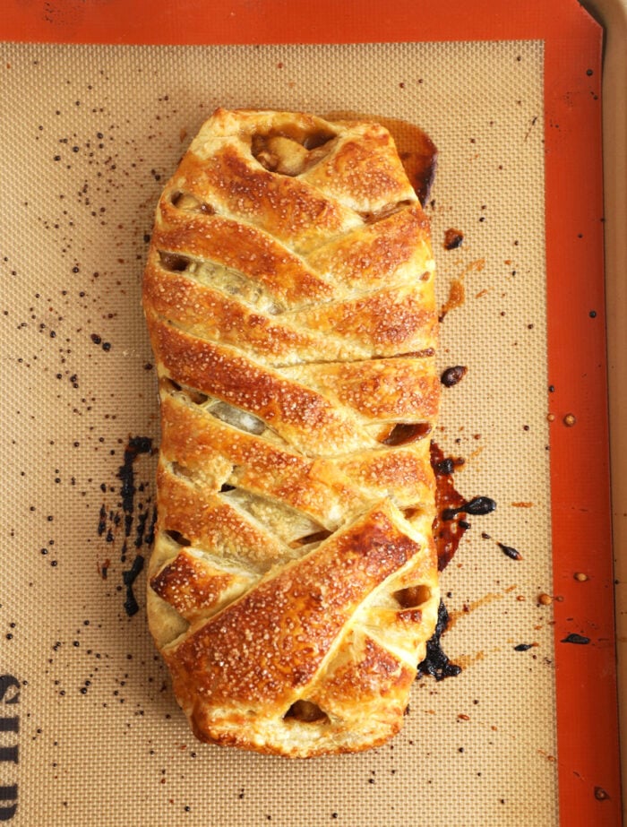 Overhead view of baked apple strudel on silpat