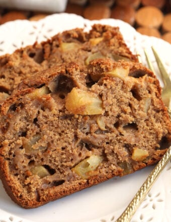 Slices of moist cinnamon apple bread on plate