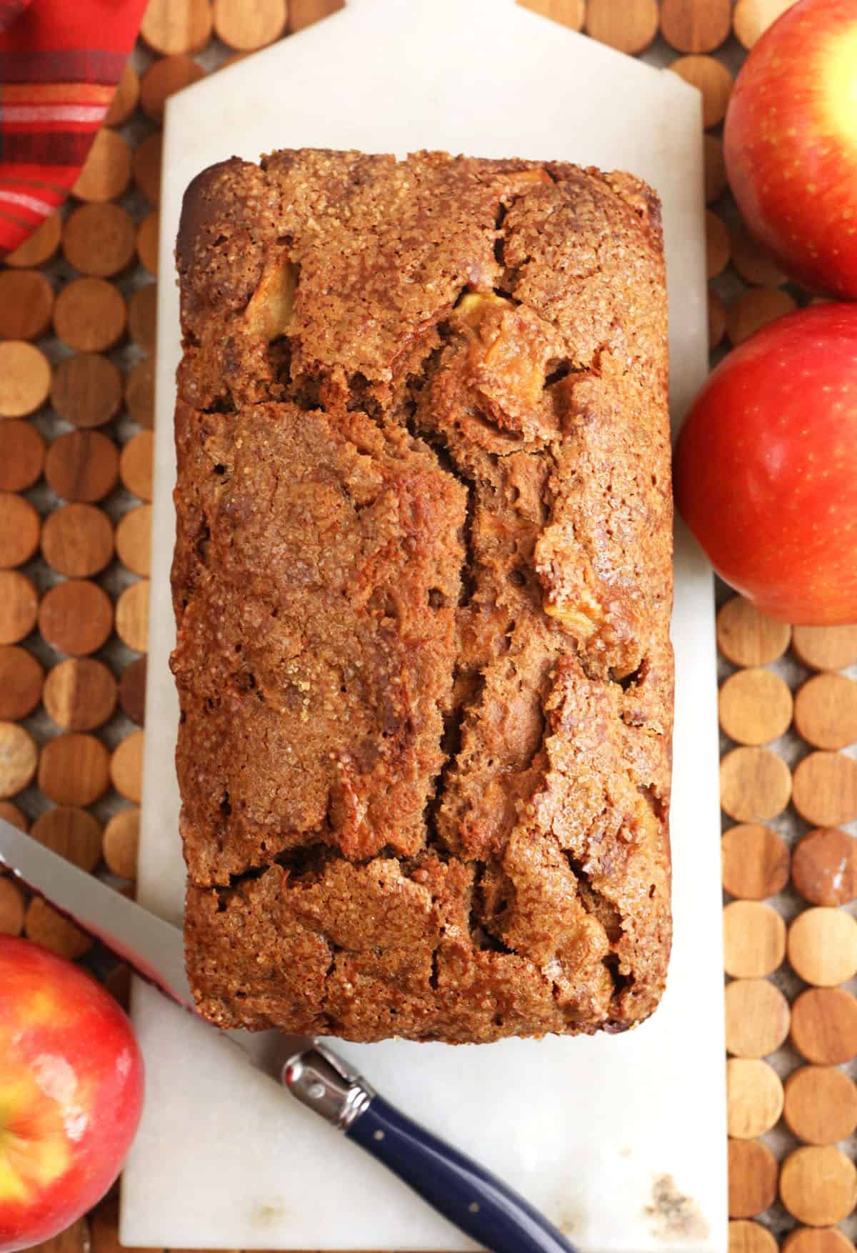 Loaf of cinnamon apple bread on cutting board