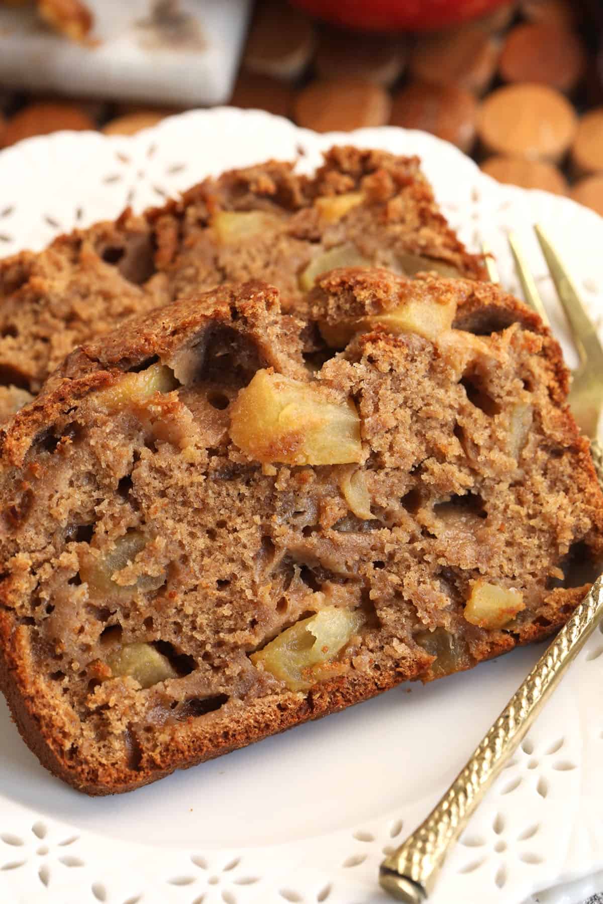 Slices of moist cinnamon apple bread on plate