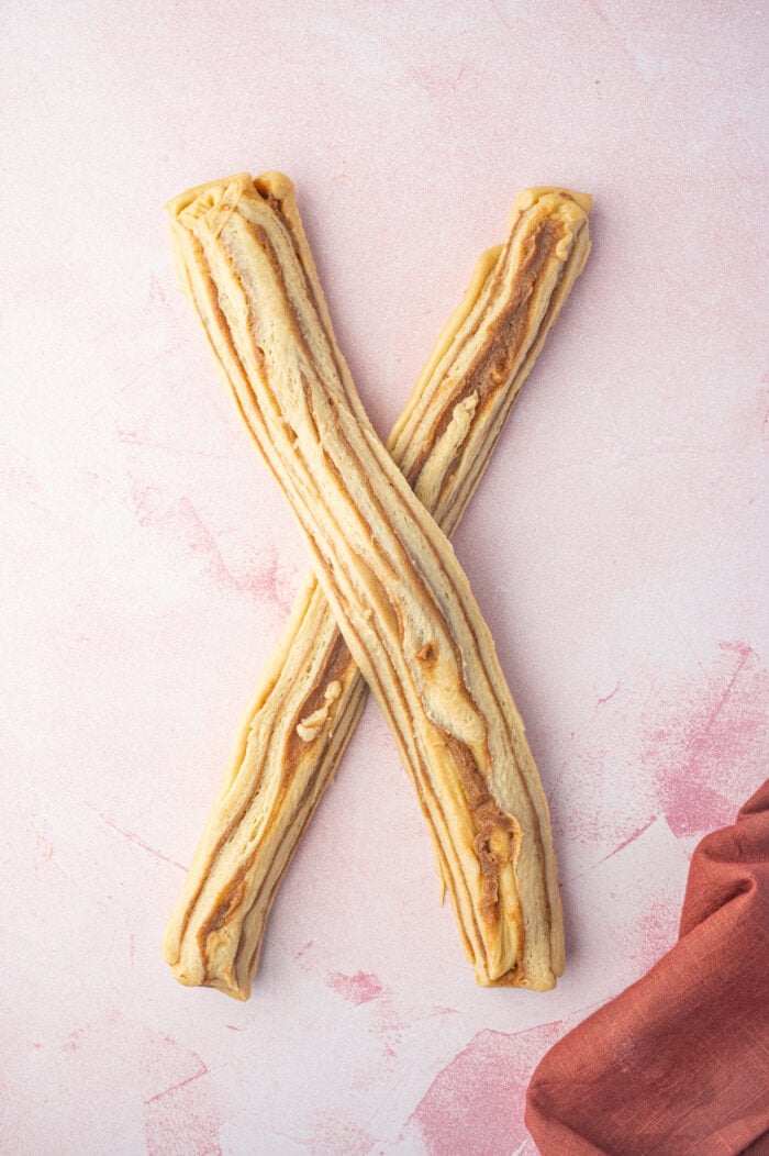 Two halves of cinnamon babka dough on top of each other