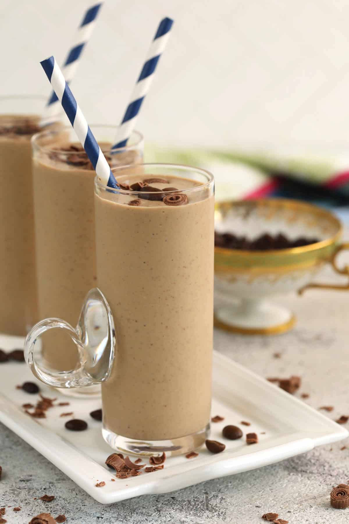 Three coffee smoothies lined up on platter