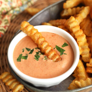 Bowl of French fry sauce with fry