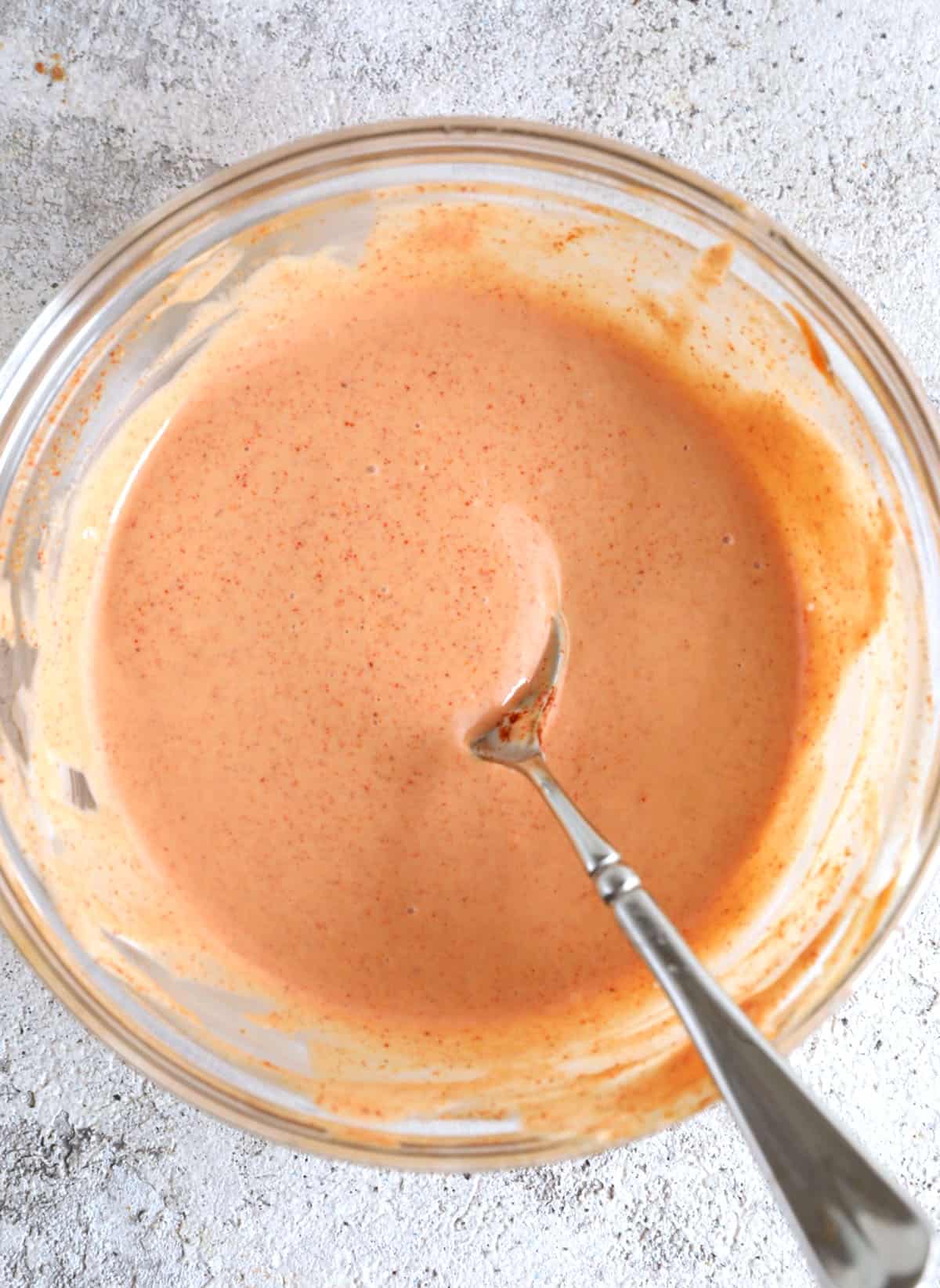 French fry sauce in mixing bowl with spoon