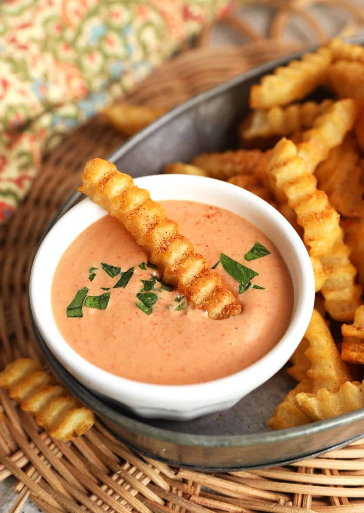 Bowl of French fry sauce with fry