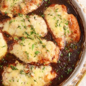 Overhead view of French onion chicken in skillet