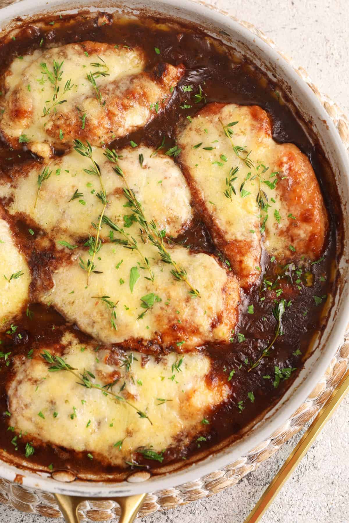 Overhead view of French onion chicken in skillet