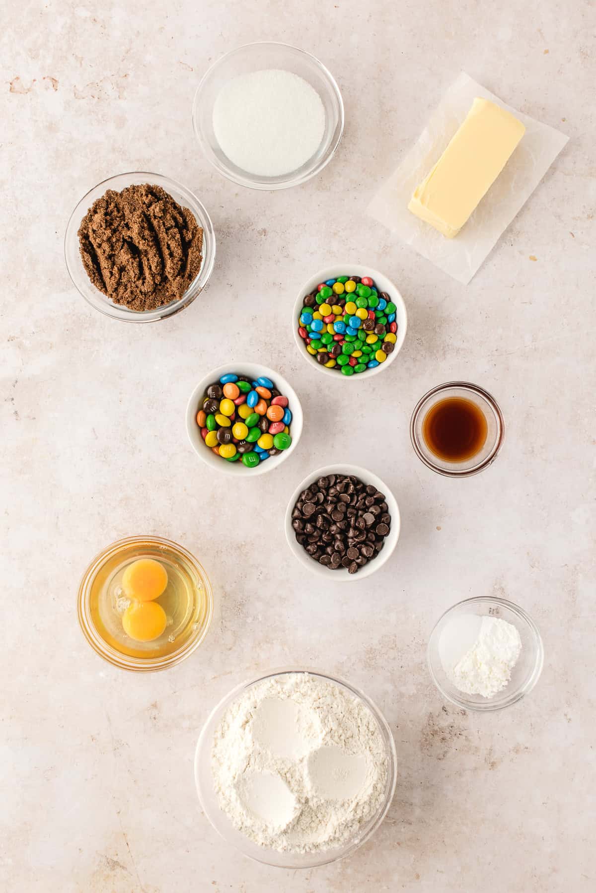 Overhead view of ingredients for chocolate chip M&M cookies