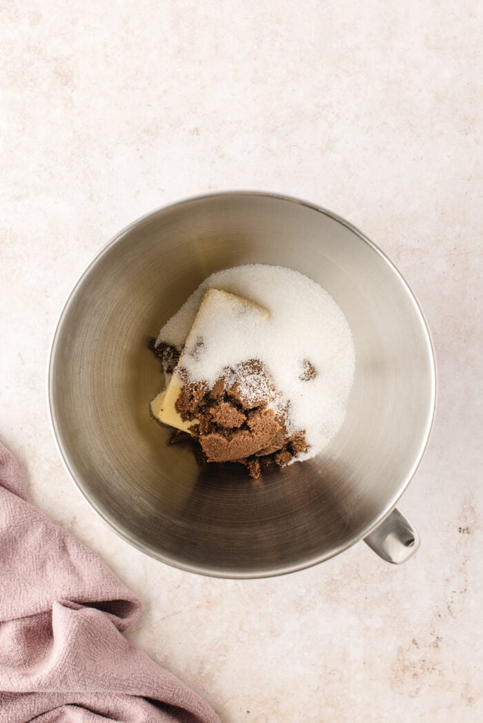 Butter, white sugar, and brown sugar in mixing bowl