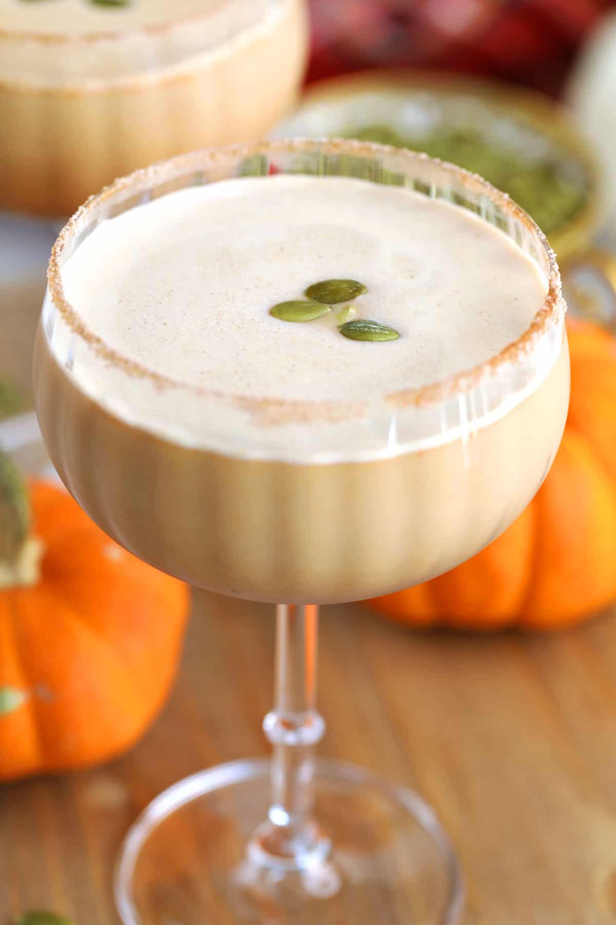 Pumpkin spice latte martini topped with pepitas