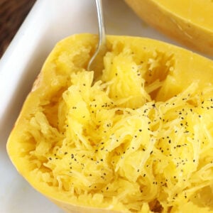 Cooked spaghetti squash in dish with fork