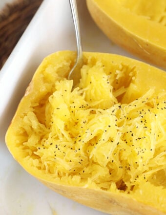 Cooked spaghetti squash in dish with fork