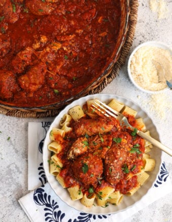 Sunday gravy served over pasta and in Dutch oven