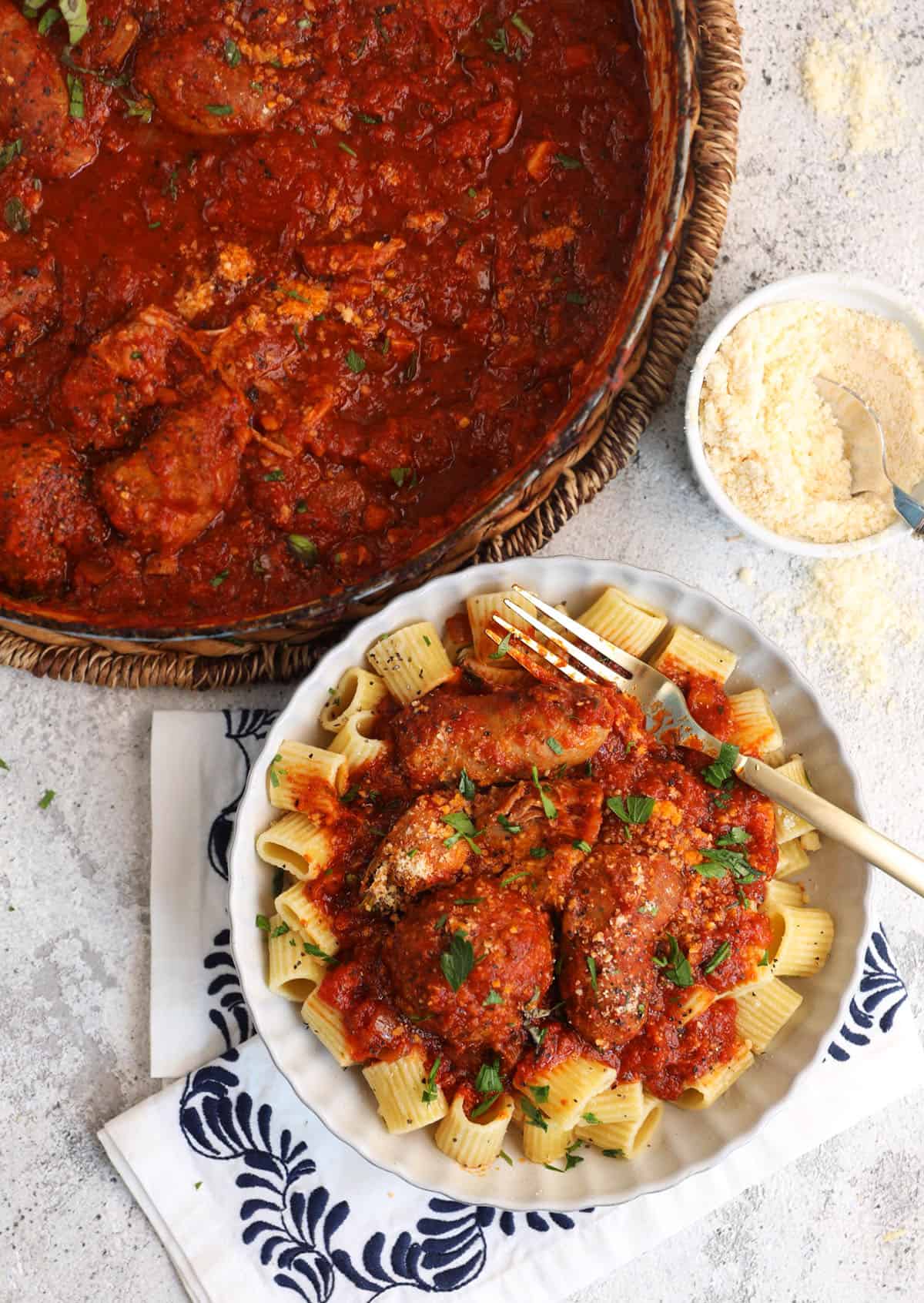 Sunday gravy served over pasta and in Dutch oven