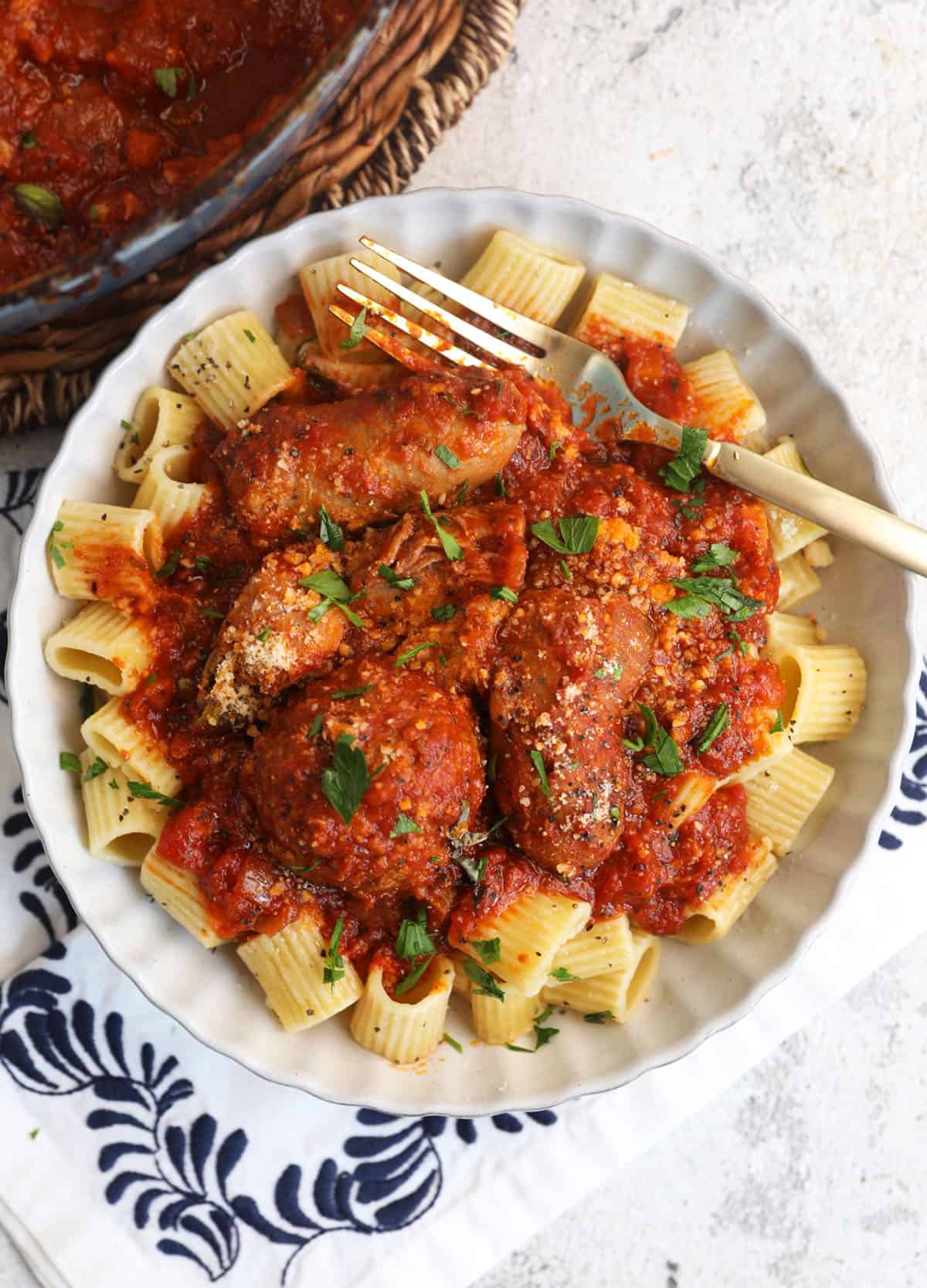 Overhead view of Sunday sauce served over pasta