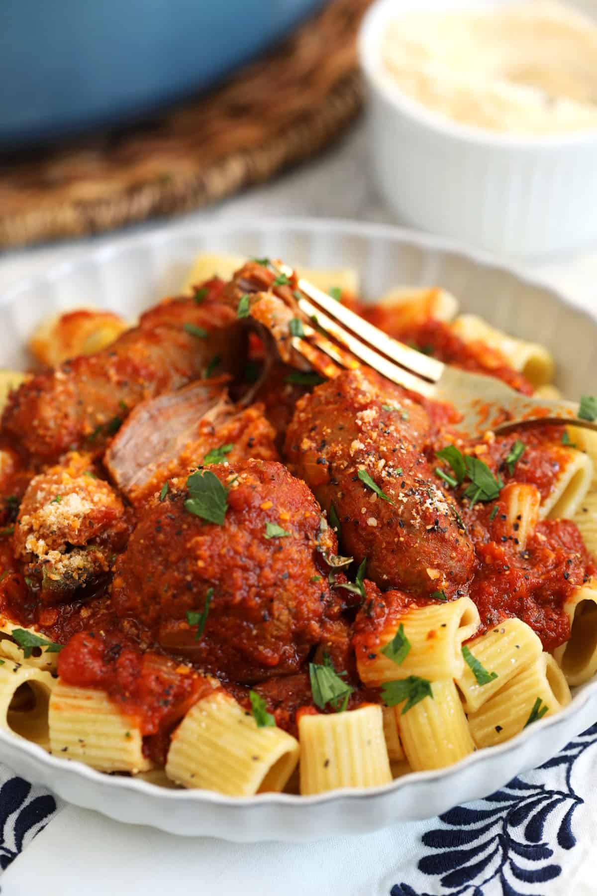 Sunday gravy served over bowl of pasta