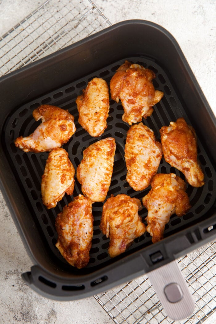 Raw air fryer chicken wings in air fryer basket