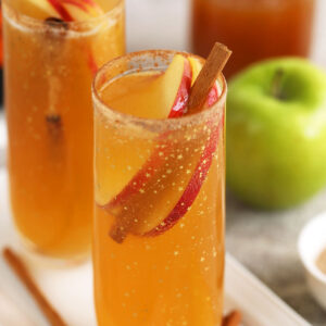 Apple cider mimosas in champagne flutes