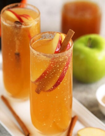 Apple cider mimosas in champagne flutes