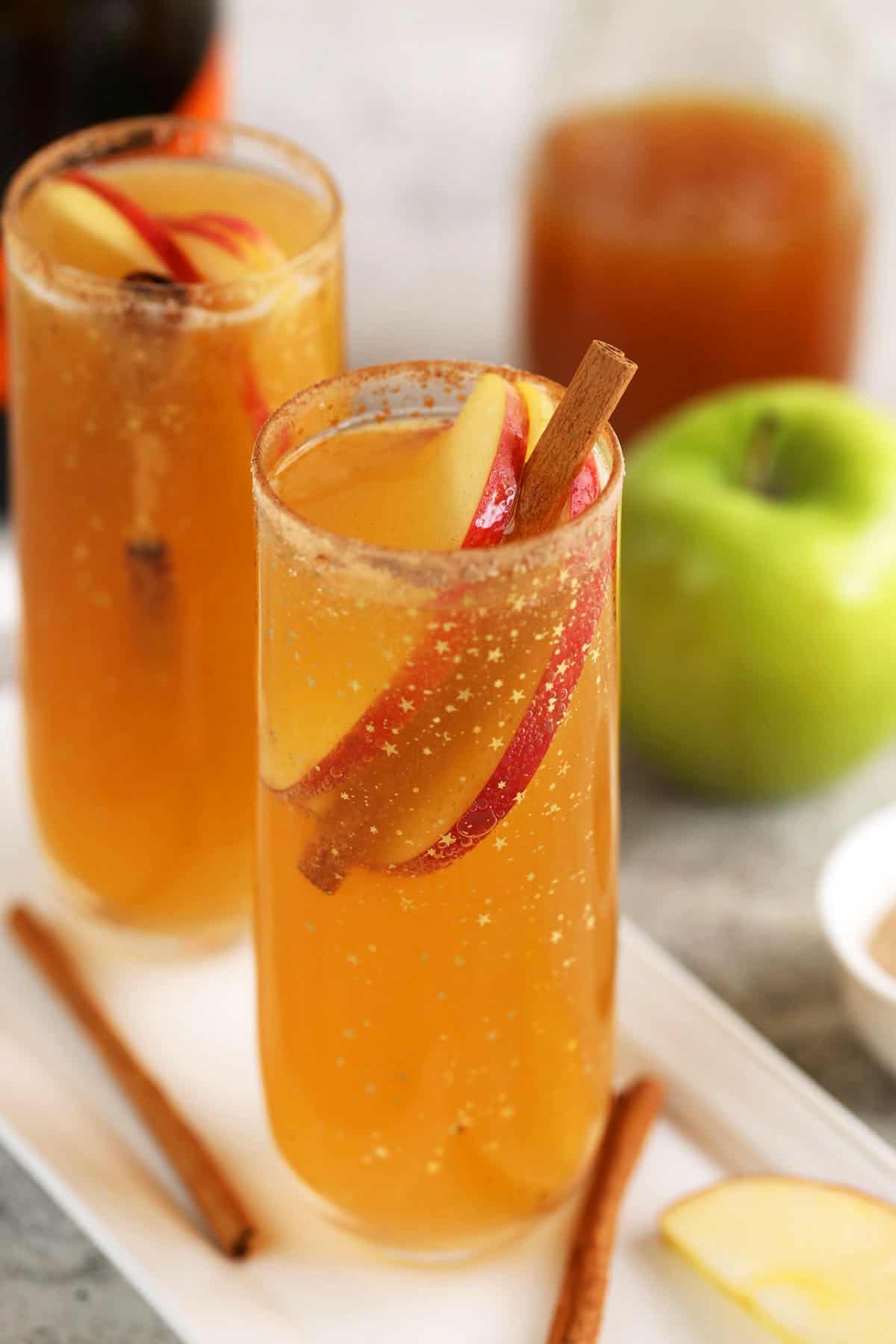 Apple cider mimosas in champagne flutes