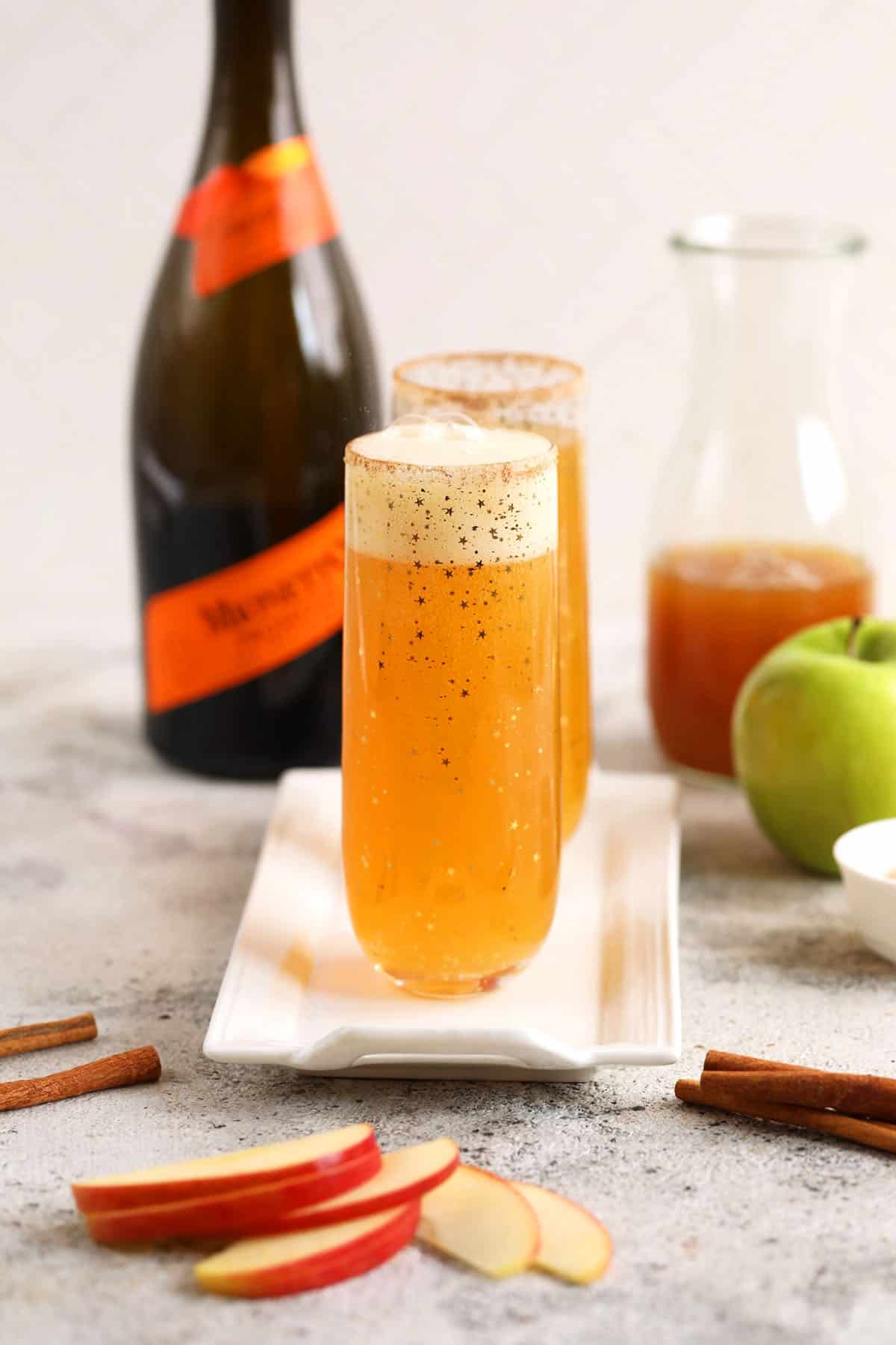 Apple cider mimosas on tray