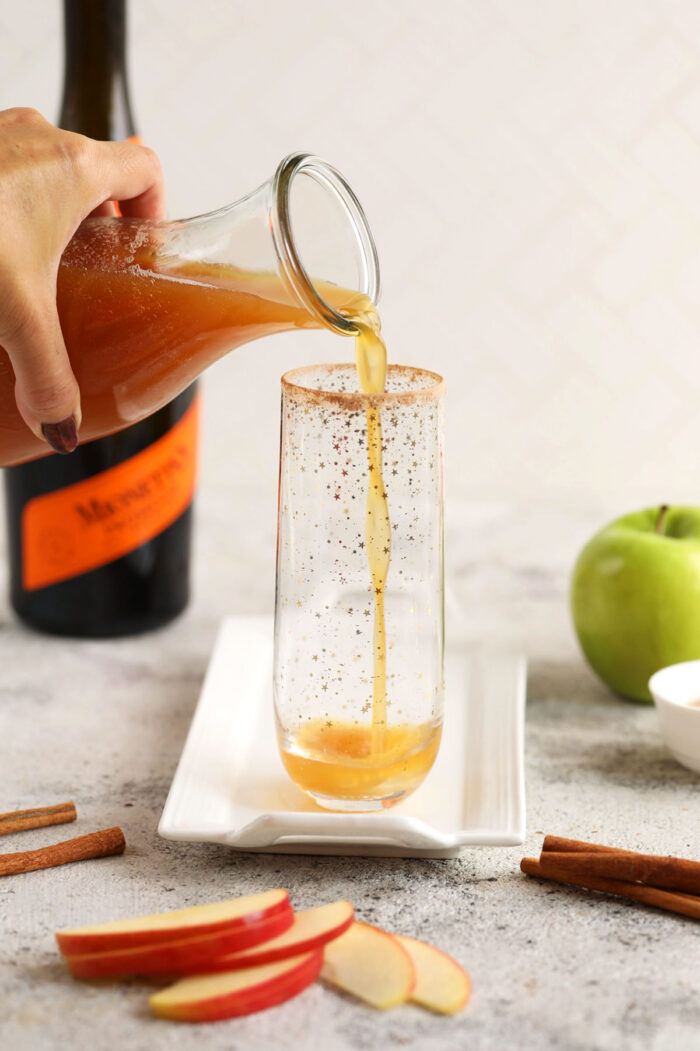 Pouring apple cider into flute